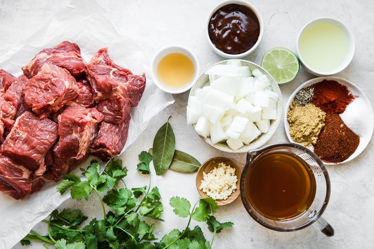 ingredients for Slow Cooker Barbacoa Beef steak, cilantro, stock, spices, garlic