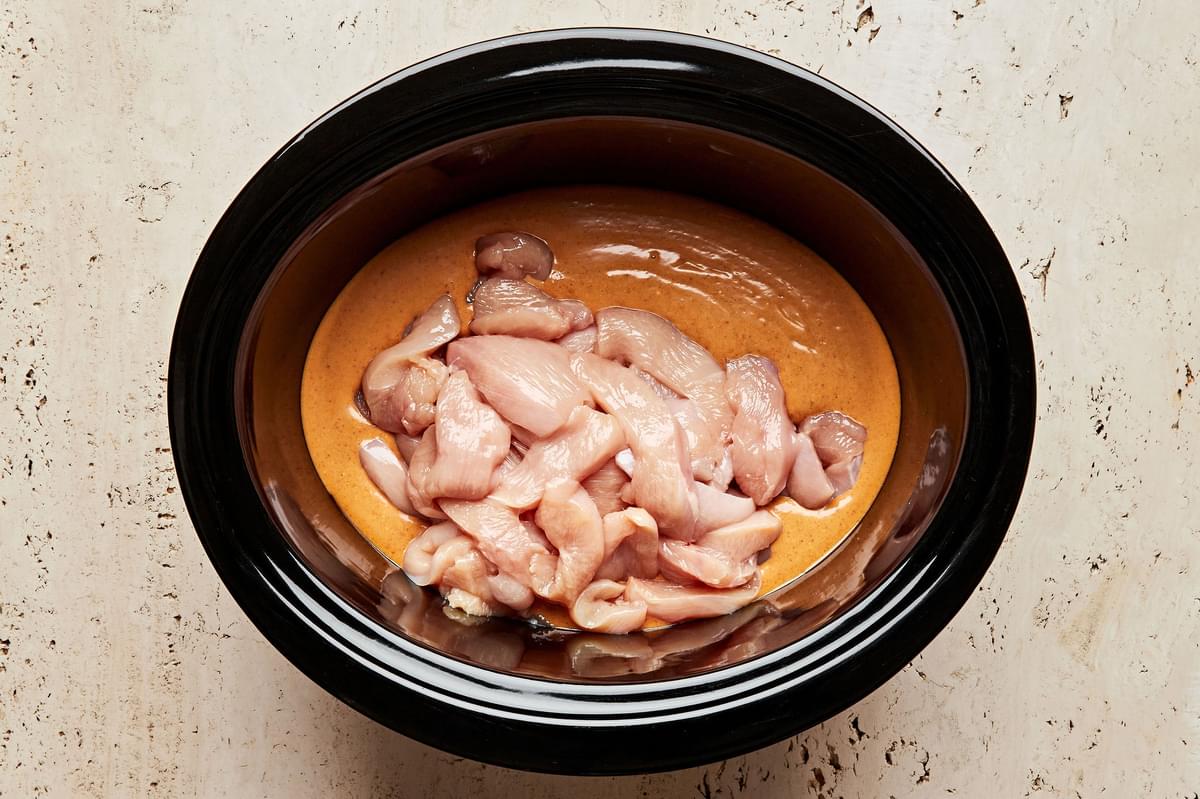 chicken, peanut butter, coconut cream, red curry, soy sauce, brown sugar, fish sauce & apple cider vinegar in a slow cooker