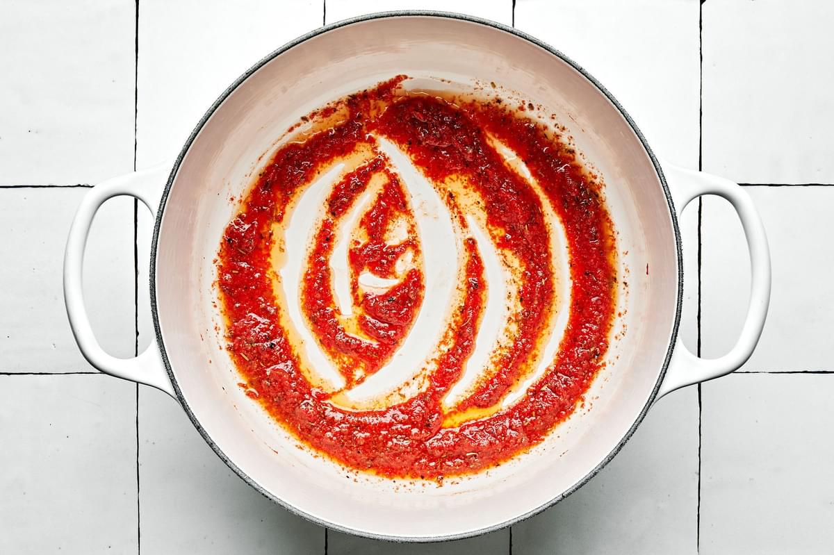 tomato paste, butter, Italian seasoning, garlic powder, onion powder, salt and pepper in a pot