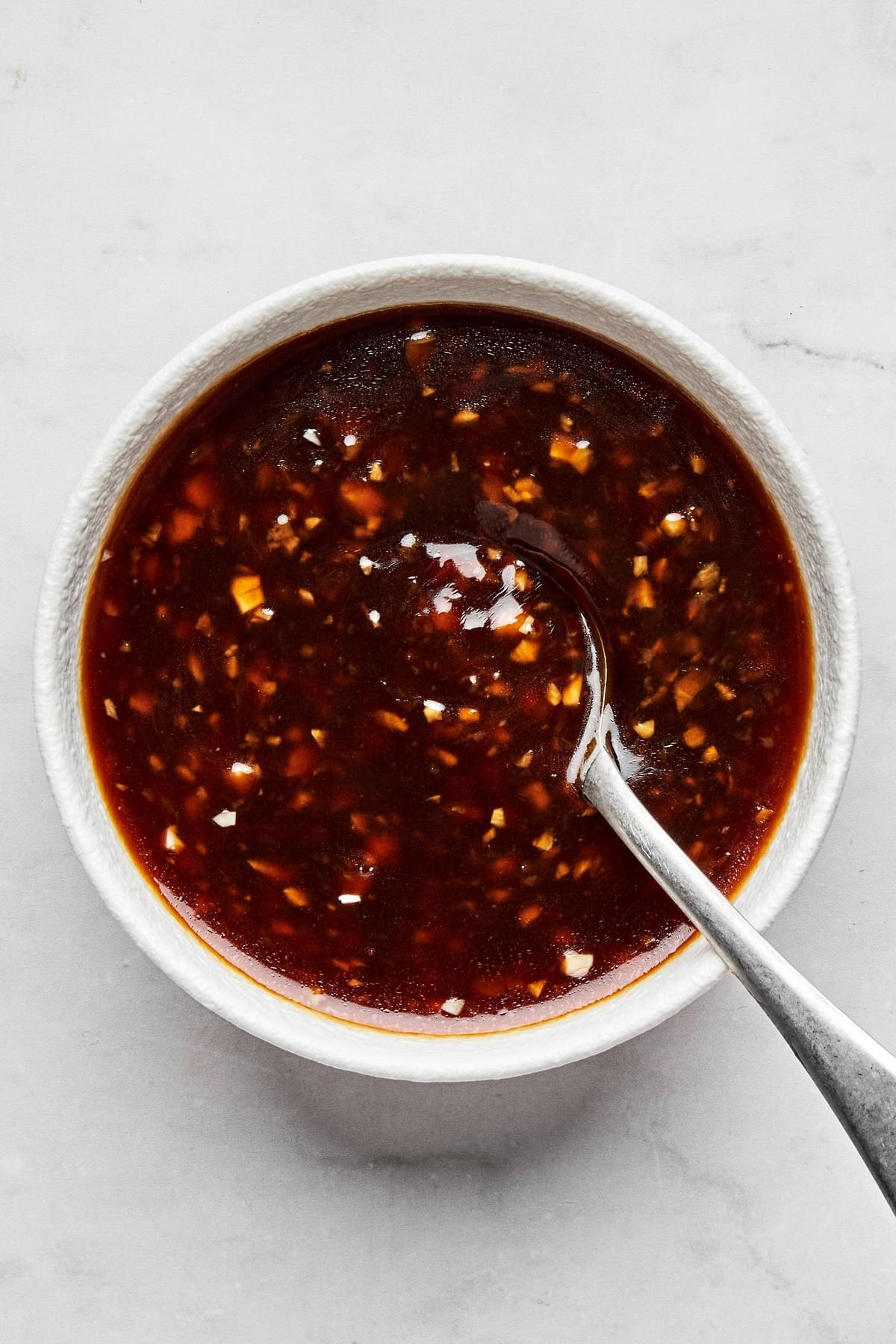 homemade stir fry sauce made with tamari, sesame oil, garlic, ginger, brown sugar, red pepper flakes and cornstarch in a bowl
