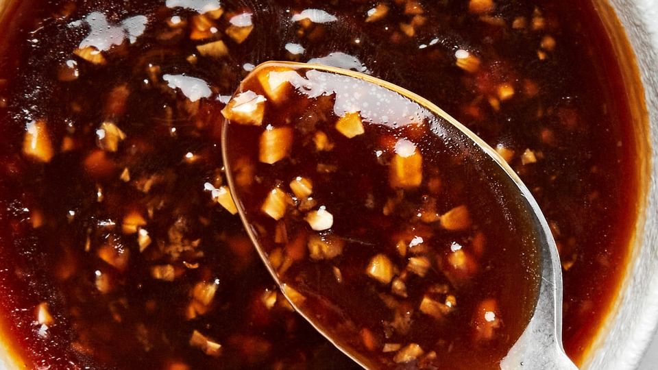 a dish of homemade stir fry sauce made with tamari, sesame oil, garlic, ginger, brown sugar, red pepper flakes and cornstarch