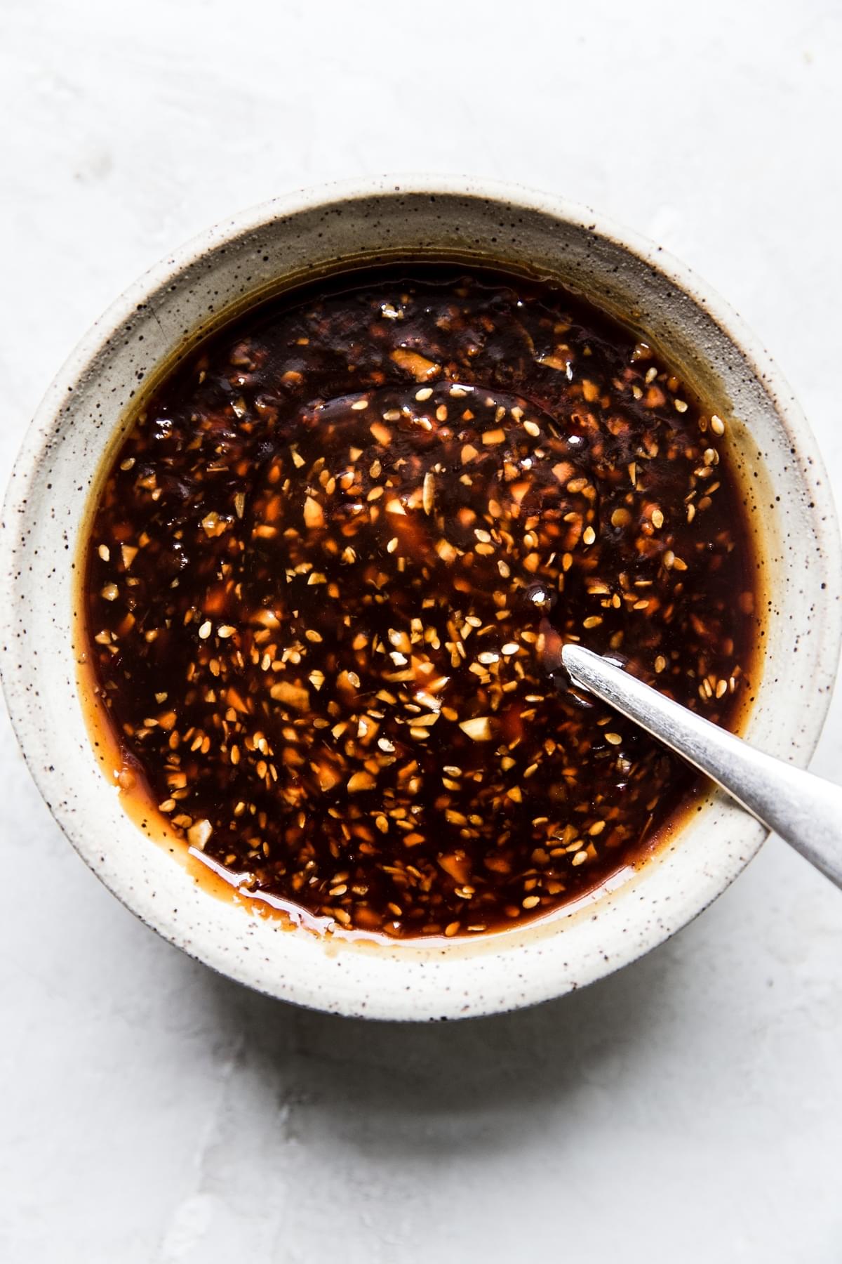 garlic and ginger teriyaki sauce in a small bowl with a spoon