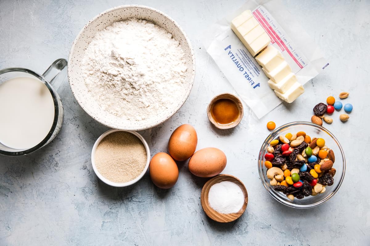 ingredients laid out for trail mix pancakes butter, flour, eggs and milk