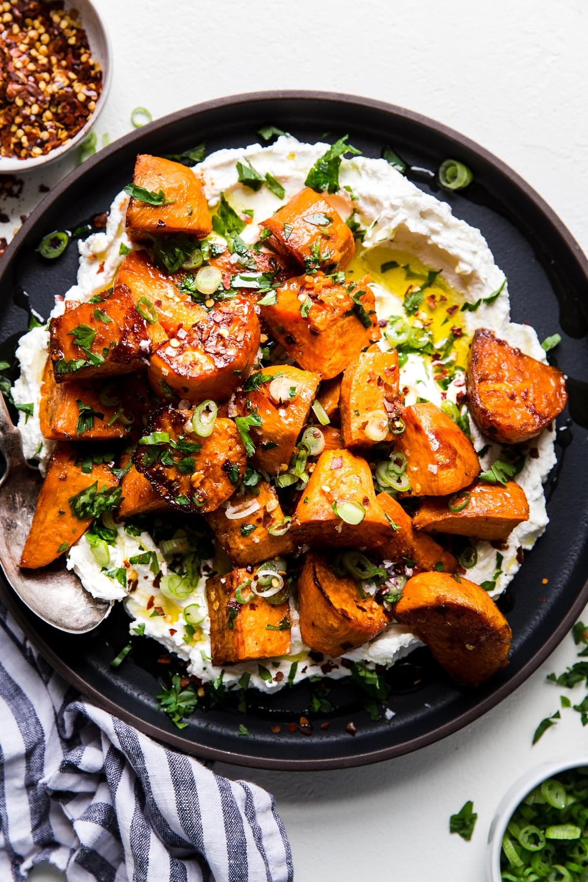 Honey roasted sweet potatoes with labneh on a plate