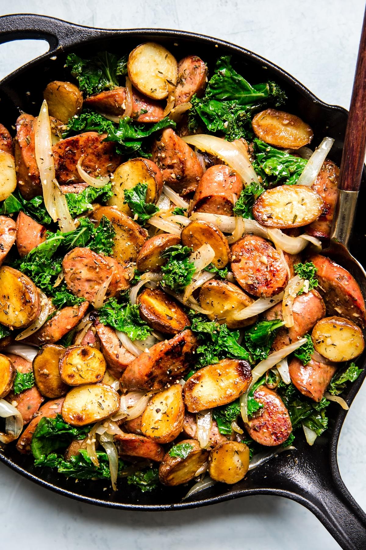 Sausage kale and potato skillet dinner in a cast iron skillet