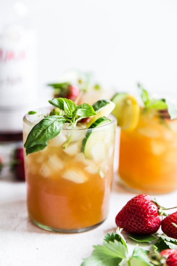 Pimm's Cup cocktail with strawberries, cucumber and basil