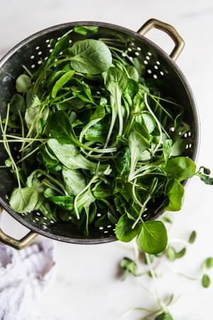 Colander full of spring greens