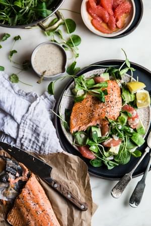 salmon and grapefruit salad with honey mustard dressing styled on a plate