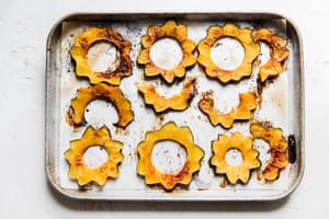 Maple roasted acorn squash on a baking sheet