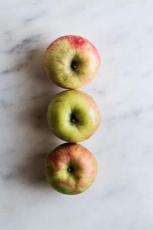 3 honey crisp apples on the counter
