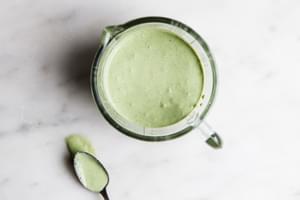 yogurt green goddess salad dressing a container with a spoon