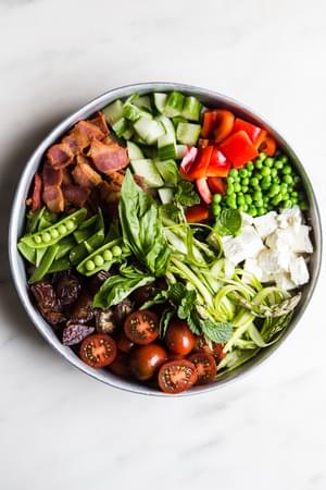 Spring Chop Salad With Asparagus And Peas tomatoes, feta dates and bacon