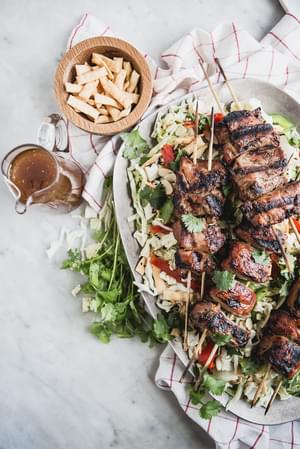 Asian Chopped Salad with Hoisin Marinated Pork Kabab on a platter