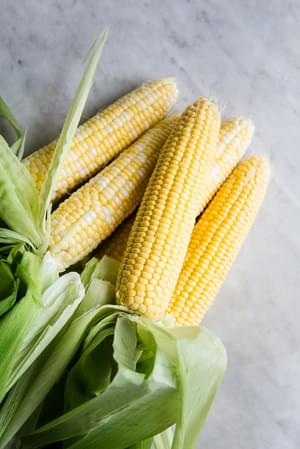 butter, leeks and corn kernels sautéing in a pot for Corn and Leek Bisque