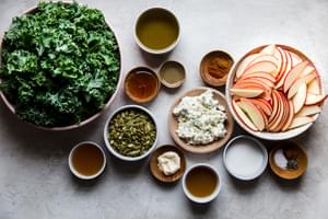 kale, apples, honey, pumpkin seeds, goat cheese, cinnamon, olive oil