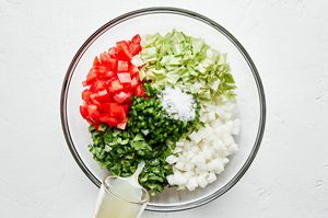 tomatoes, onion, cabbage, jalapenos, cilantro, lime juice and salt in a bowl to make pico de gallo with cabbage