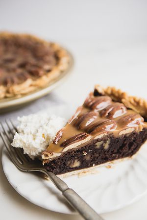 a slice of chocolate pecan pie