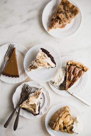 slices of pecan pie, apple pie, pumpkin pie