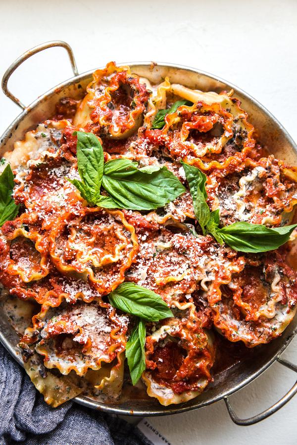 4 cheese and mushroom rolled lasagna in a baking dish