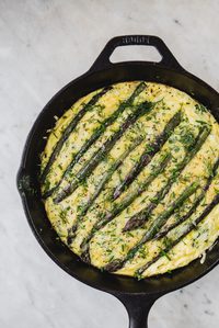 Asparagus Frittata With Crème Fraîche in a cast iron pan