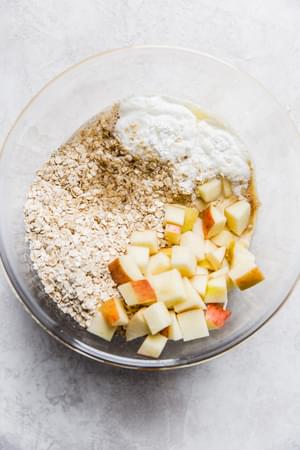 quick cooking oats, diced apples, milk, vanilla, and egg in a bowl