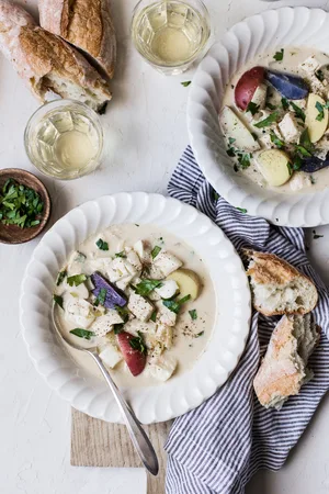 Bourride French Fish Stew with aioli and potatoes in bowls