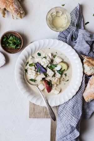 Bourride French Fish Stew with aioli and potatoes in bowls