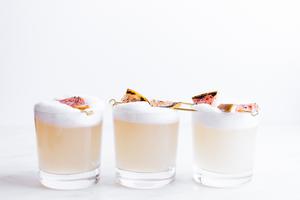 three glasses of Charred Grapefruit & Mezcal Paloma Sour