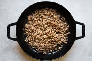 ground beef browned in a cast iron pan