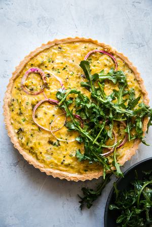 onion tart with and arugula salad