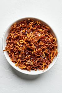 a bowl of homemade fried shallots seasoned with kosher salt