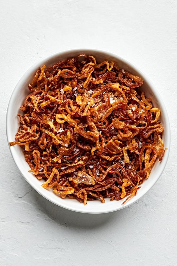 a bowl of homemade fried shallots seasoned with kosher salt
