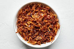 a bowl of homemade fried shallots seasoned with kosher salt