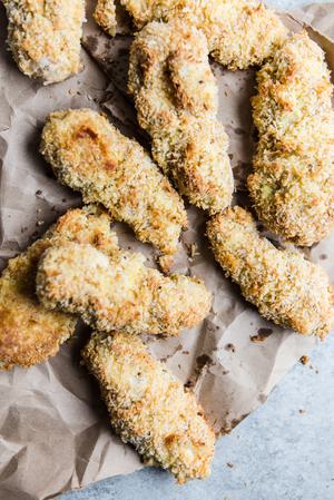 homemade baked chicken tenders on parchment paper