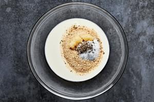 heavy cream, breadcrumbs, garlic, salt, and pepper in a bowl to use for making homemade meatballs