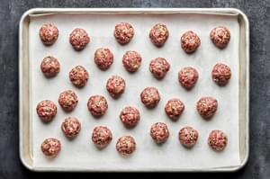 meatballs made with ground pork, ground beef, parsley, parmesan, heavy cream, breadcrumbs, garlic, salt, and pepper