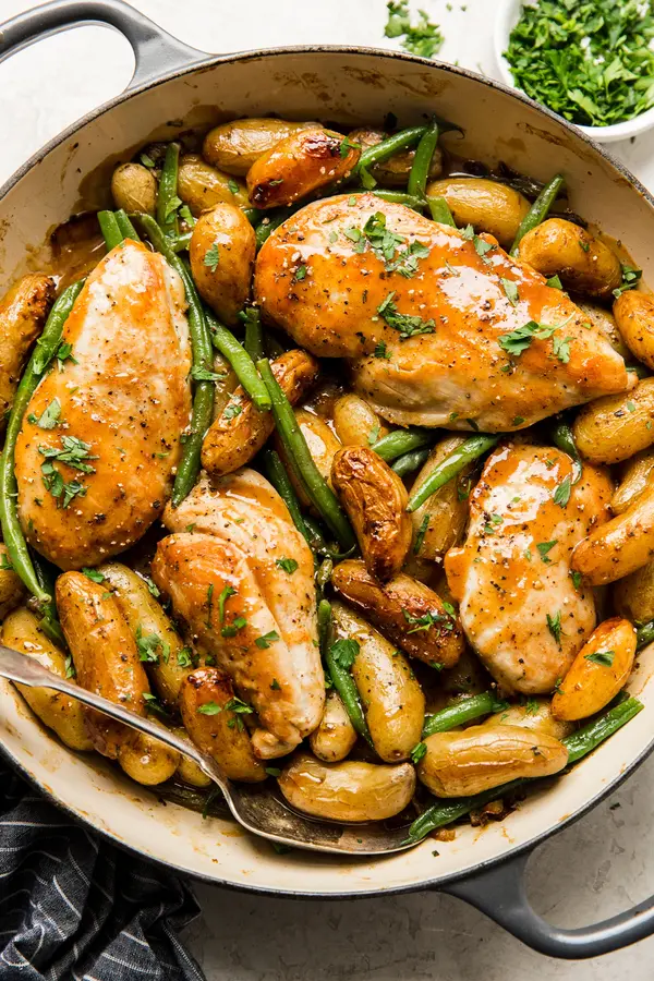 one pan honey mustard chicken, potatoes, green beans in a braiser