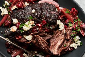 Pot Roast with Tart Cherry-Black Pepper Sauce topped with parsley and gorgonzola cheese