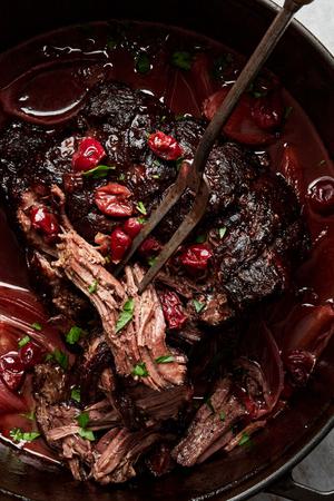 Pot Roast with Tart Cherry-Black Pepper Sauce in a dutch oven