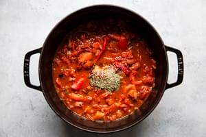 stock, roasted red peppers, fire roasted tomatoes, garlic, spices and onions in a soup pot for roasted red pepper soup