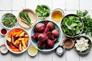 beets, carrots, spring salad mix, green onions, olive oil, goat cheese, spices, basil, parsley and lemon juice in prep bowls