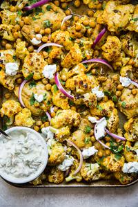 tandoori chicken sheet pan dinner with cauliflower, seasoned with turmeric, cumin and cinnamon