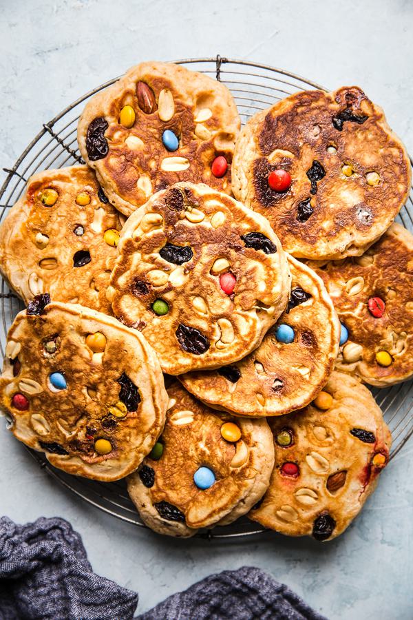pancakes made with trail mix m&ms, peanuts and raisins