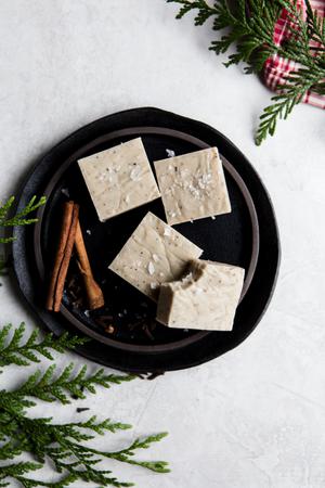 homemade white chocolate chai fudge cut into squares on a plate