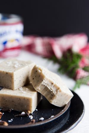 homemade white chocolate chai fudge cut into squares on a plate