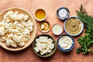 cauliflower florets, olive oil, salt, za'atar, parsley, feta, cream cheese, garlic, dill and lemon juice in prep bowls