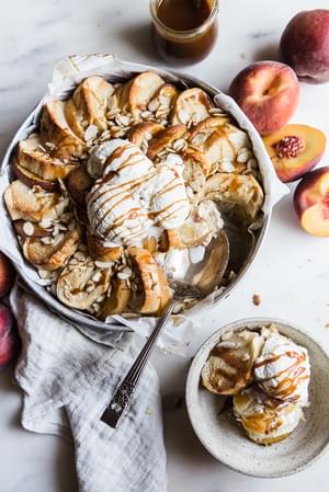 Almond Peach Bread Pudding with ice cream and caramel sauce