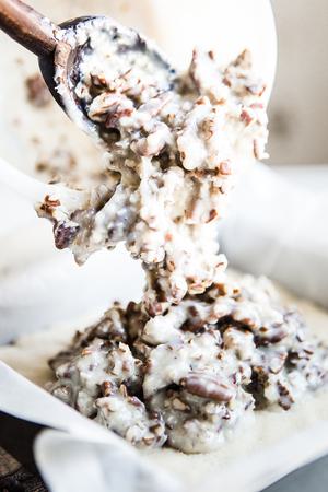 Coconut Pecan Caramel Bars poured into a pan