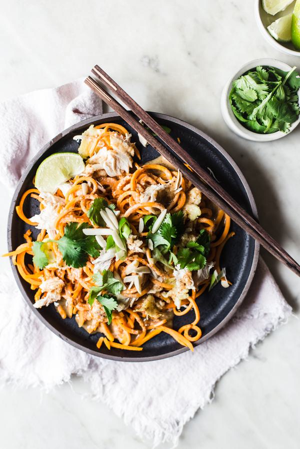 Pad Thai made with sweet potato noodles with cilantro and lime on a plate