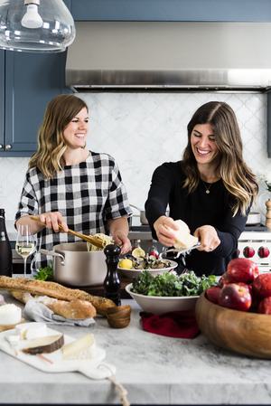 two ladies in a kitchen cooking Steamed Clams With Linguini